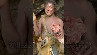 Hadzabe tribe bushmen people love to cook and eat the food that nature provides them with