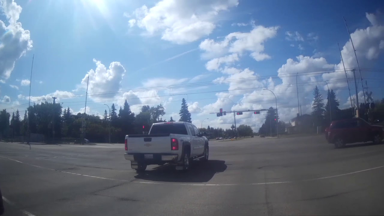 DRUNK OR HIGH DRIVER IN A CHEVY TRUCK BLOWS THRU A RED LIGHT - YouTube