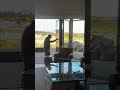 One finger effortlessly opens 15 feet of glass, the ease of NanaWall Systems.