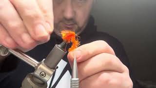 Tying an orange fab 