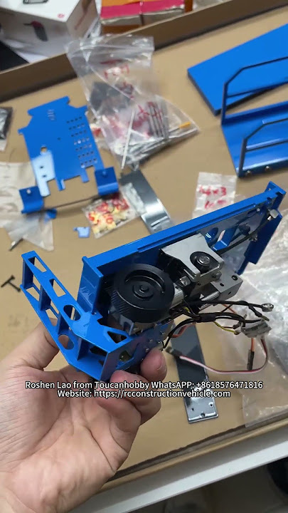 THE 1/14 C121 AERIAL WORK PLATFORM TRUCKS IN CUSTOM ORANGE AND BLUE HAVE BEEN PAINTED AND ASSEMBLED