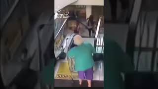 grandma falls down escalator