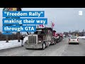 Truckers with the “Freedom Rally” make their way through the GTA’s main roadways