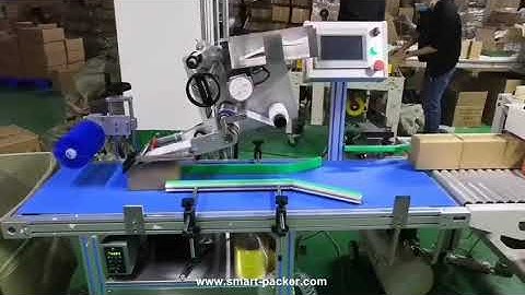 Automatic small carton box pushing down top flat surface labeling machine running video