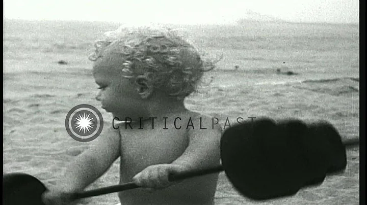 22 months old baby Larry Samson plays a game of bo...