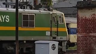 WAG9HC 43036 UNIQUE SILVER/GREEN/YELLOW/GREEN FREIGHT ENGINE HAULS FREIGHT TRAIN AT JAIPUR