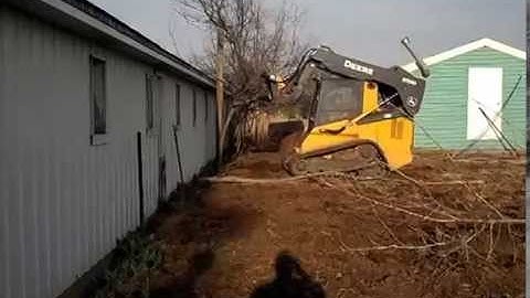 Removing trees next to a building. ZT-17 tree puller at http://treepropullers.com