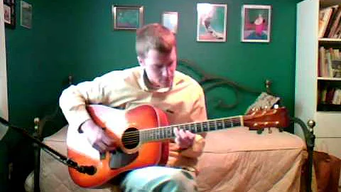 Peter Tarricone playing steel string acoustic guitar