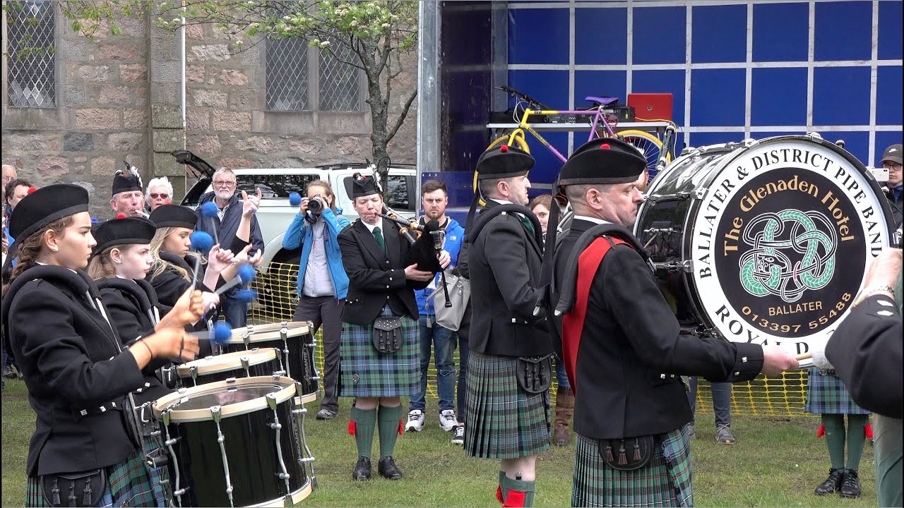 Ballater Pipe Band Playing 2/4 time marches on the green during the
