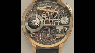 ‏ساعة ميكانيكية أنيقة بتصميم استخراج النفط.كم تتوقع ثمن هذه الساعة العجيبه
