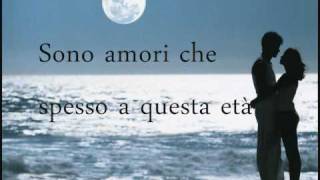 Video thumbnail of "Laura Pausini - Strani Amori + lyrics"