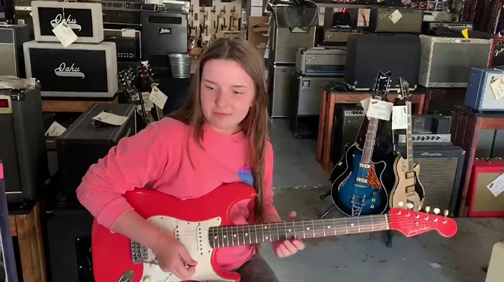 Ally Venable at Jimmy Wallace Guitars trying out D...