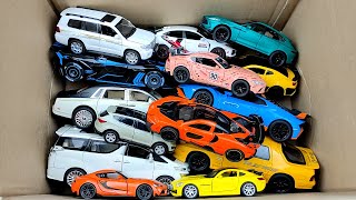 Box full of various miniature cars Rolls Royce, Aston Martin, Toyota Vellfire, Maybach, Bugatti 04