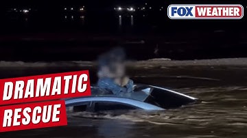 Watch: Man, Child Rescued From Roof Of Car Amid Fast-Flowing Floodwaters In Arizona