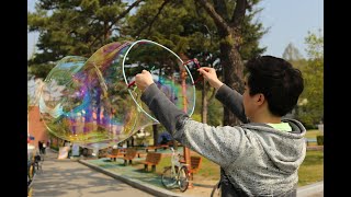 Slow motion - Popping a Bubble from Inside at 50,000FPS