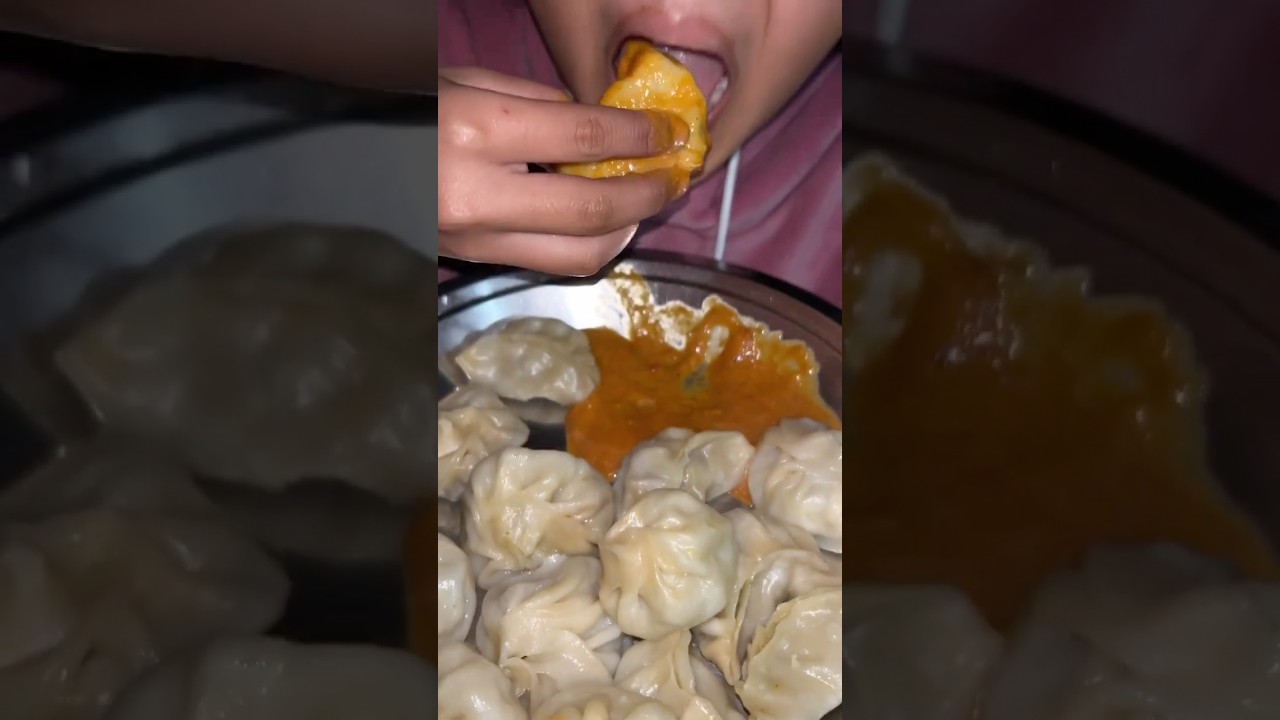 Eating juicy spicy chicken momo /Dumplings/homemade momo/ spicy chutney 