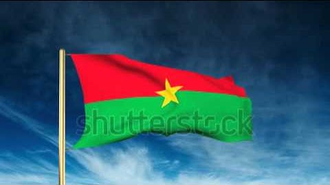 Burkina Faso flag slider style. Waving in the wind with cloud background animation Stock video by