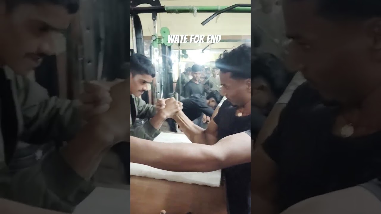 Arm wrestling game in gym arm wrestling  