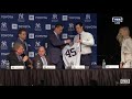 Gerrit Cole putting on Yankees Jersey