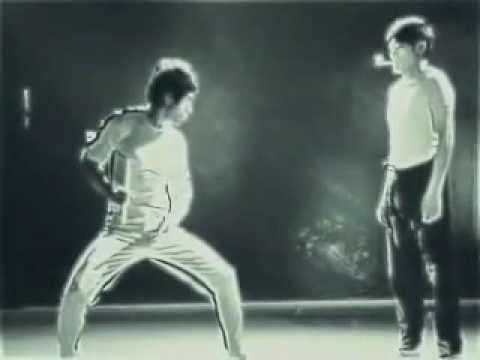 Bruce Lee Lighting Matches with Nunchucks