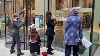 London climate activists smash glass at JPMorgan office