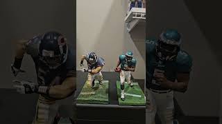 Action Figure Spotlight  Brian Urlacher &amp; Donovan McNabb.  Album of the Week: Ruff Ryders Vol. 1.