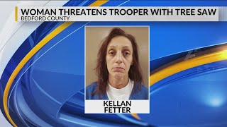 Woman charged with threatening to kill trooper with tree saw
