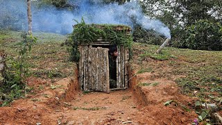 Build a warm survival shelter alone | Bushcraft earth hut - Grass roof & Fireplace with clay