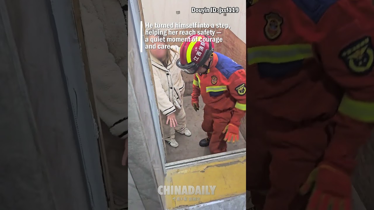 Firefighter helps trapped pregnant woman escape an elevator