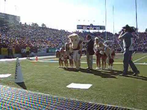 Side flip over 8 cheerleaders and Jim Knox