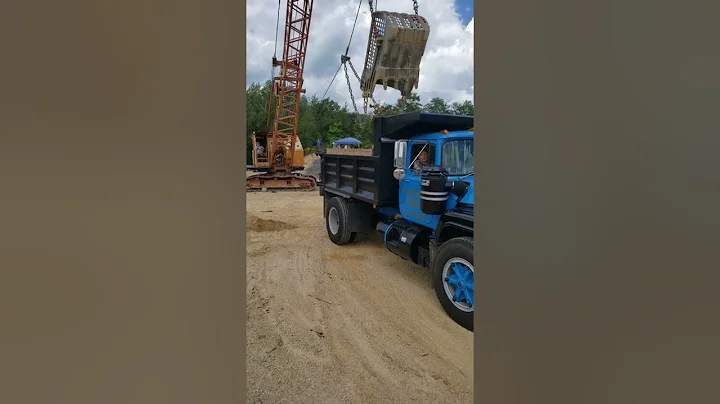 Alan Marsh in 405 Koering loading 1981 Mack at 2022 RB show