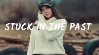 Skydrops & Deagon - Stuck In The Past (Lyrics) ft. Nino Lucarelli