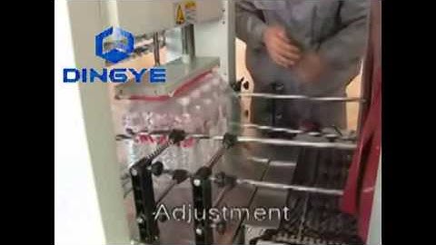 máy cắt dán màng co PE bán tự động, máy bọc màng co lốc chai nước