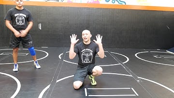 Beginner Wrestling Exercises - How to do a Backwards Extension