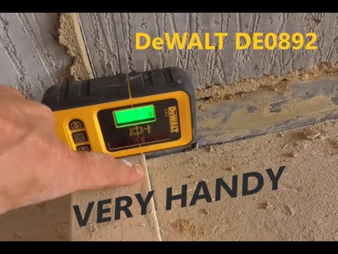 Using a laser detector to help set plumb up timber stud walls.***DeWalt DE0892***