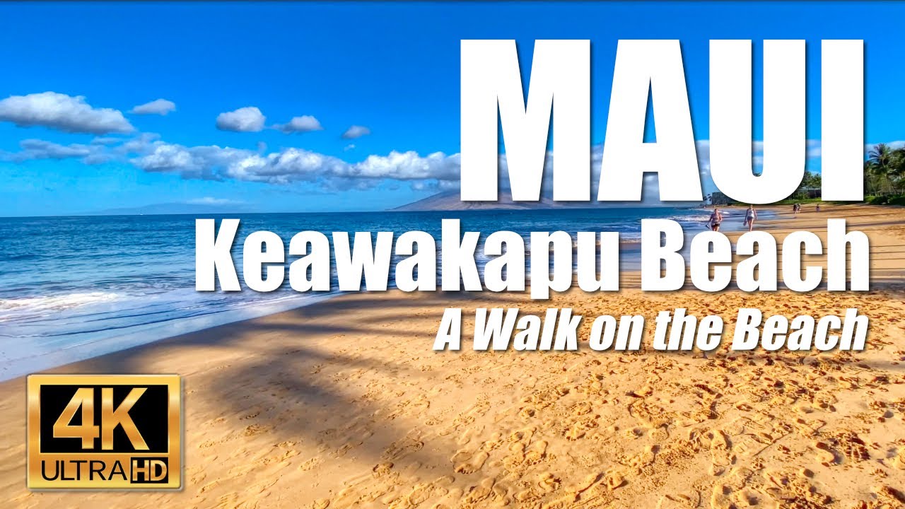 Take a walk across ocean surf rolling to shore at Keawakapu Beach in Wailea, Maui, Hawaii.    4K