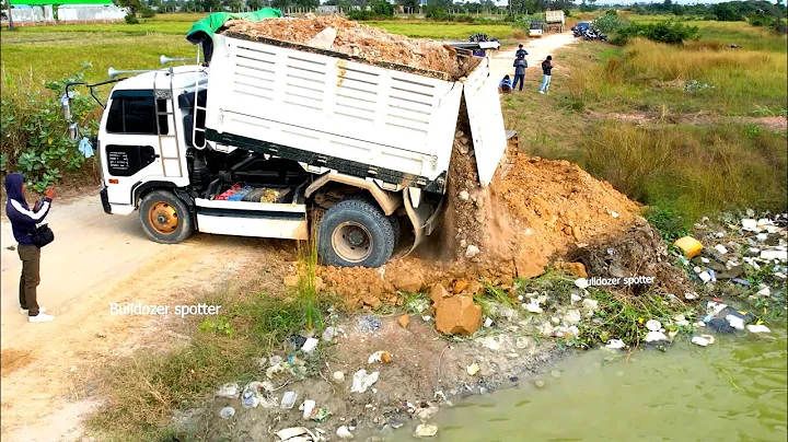 Incredible New project landfill by dump truck unloading stone & skill operator bulldozer pushing