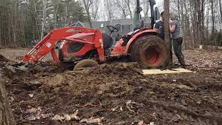 We got our Kioti CK2610 tractor stuck in mud, really stuck.  How to get a tractor out of the mud.