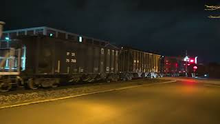 The National Lime Stone train returns eastbound empty with grain cars. The National Lime Stone train returns eastbound empty with grain cars.