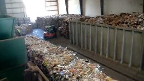 Paper being sorted at a Waste Management recycling facility