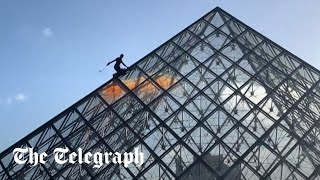 video: Watch: Climate activists scale Louvre