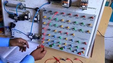 Electro pneumatic trainer kit push button used to control single acting cylinder