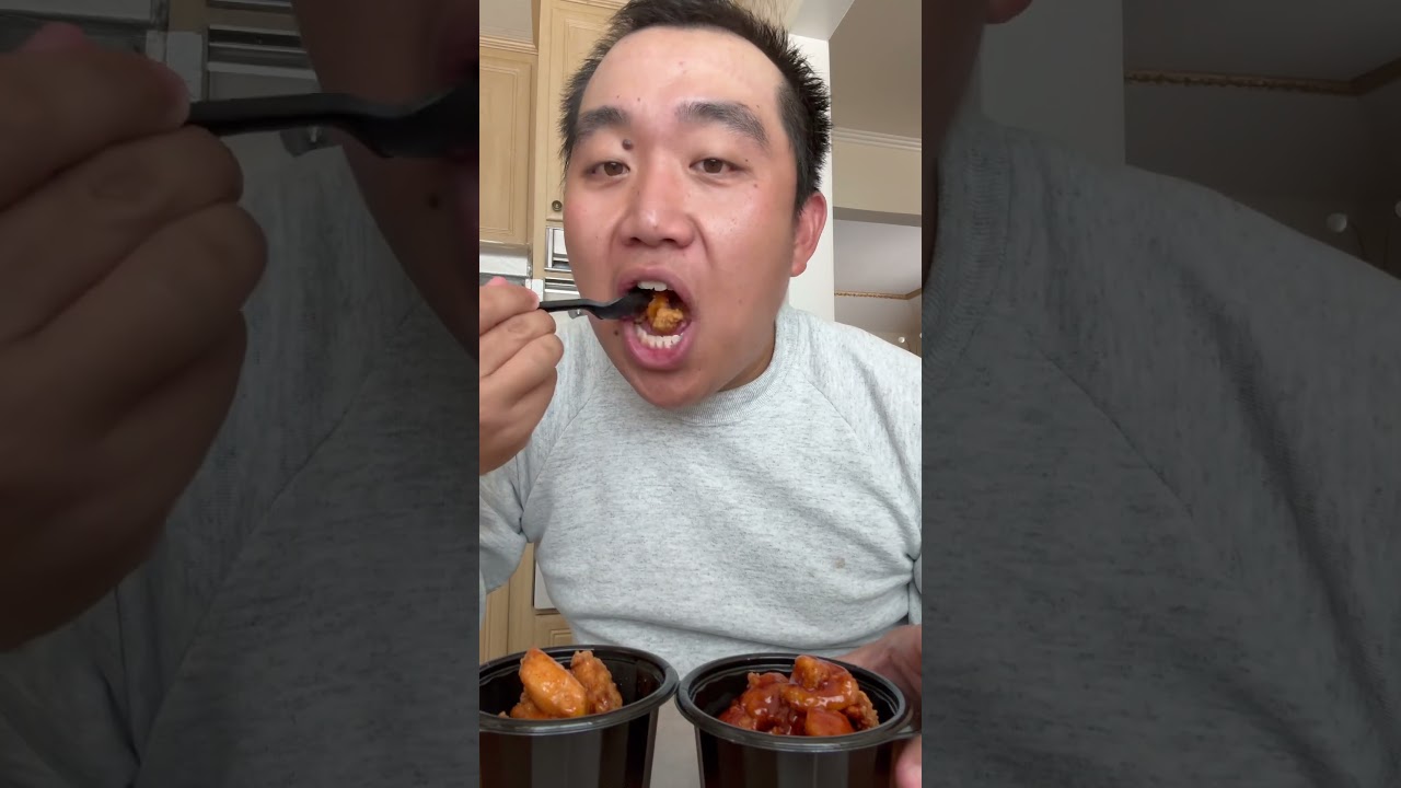 Showing and eating Saucy Nuggets from KFC Honey Sriracha and Sticky Chicky