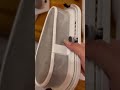 Emptying the lint trap in stackable Whirlpool dryer