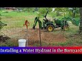 Installing a Water Hydrant in the Barn Yard with a John Deere 2025