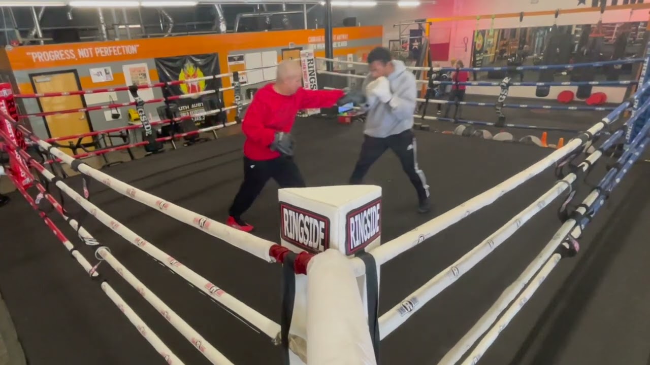 2023-01-05 Coach Conrad and Julian Working the Mitts