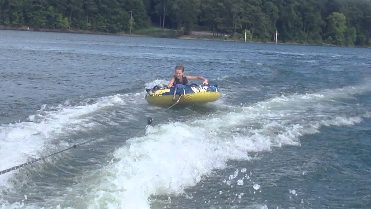 Riding on a tube behind a pontoon boat at lake Allatoona 11 year old
