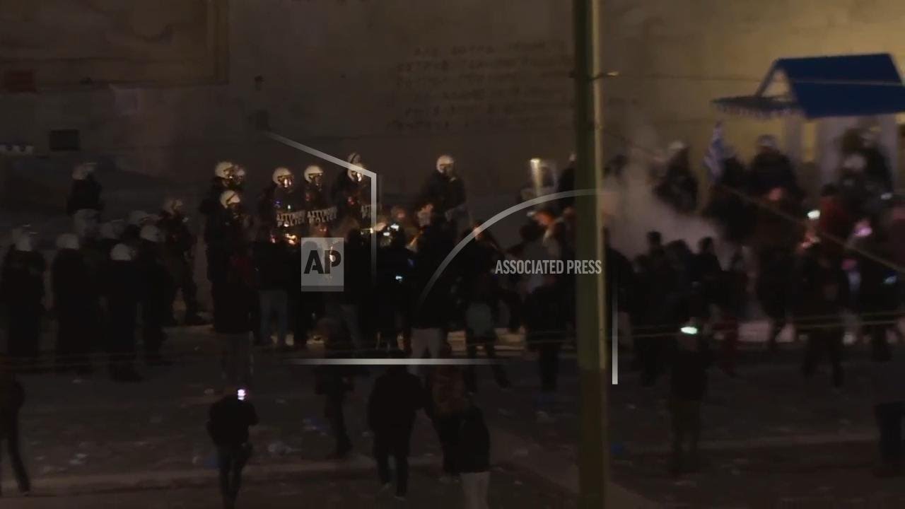 Police and protesters face off into the night in Athens after clashes on rail disaster anniversary