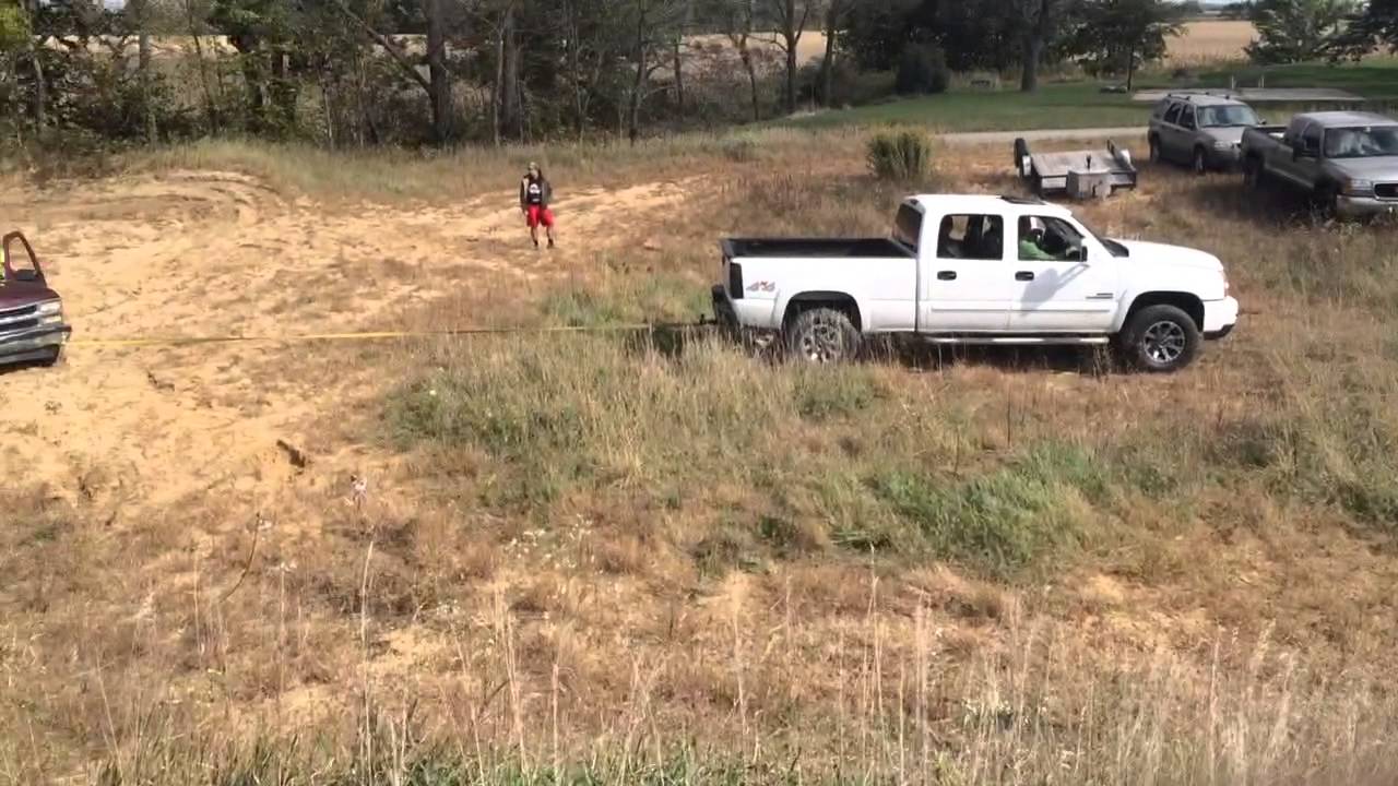 Duramax pullin stuck truck out of sand! - YouTube