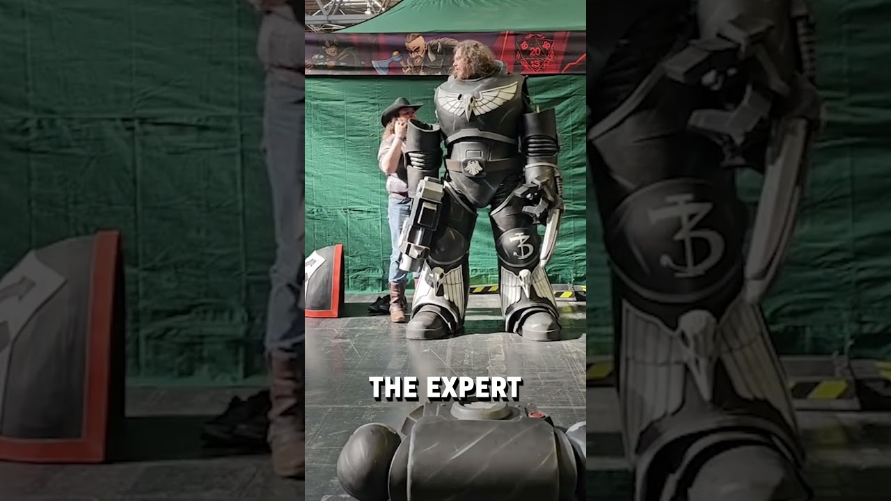 Putting on a gigantic space marine cosplay! 🤩😮  -  🎥 coraxion_cosplay